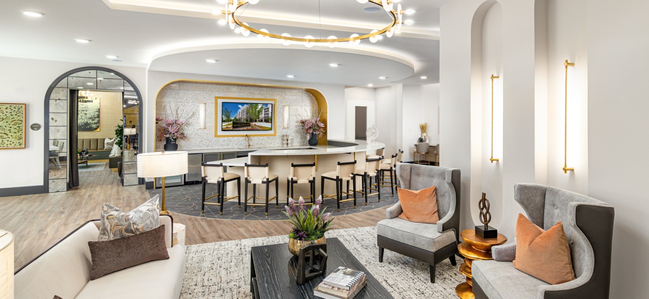 Spacious lounge area wit seating bar light fixtures coffee table