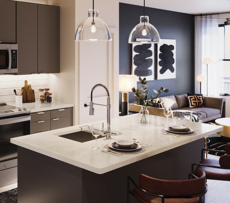 kitchen with ample counter-space, modern appliances and bright lighting